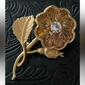 Elegant Gold Floral Brooch with Crystal Accents